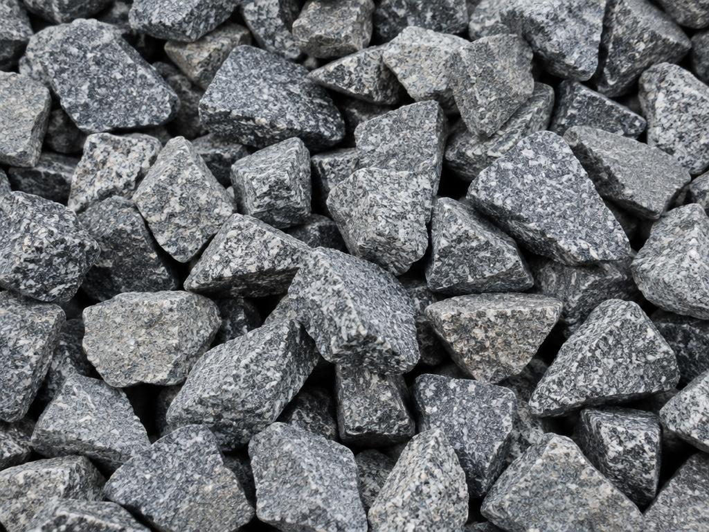 One-inch clean angular granite drainage stone with no fines