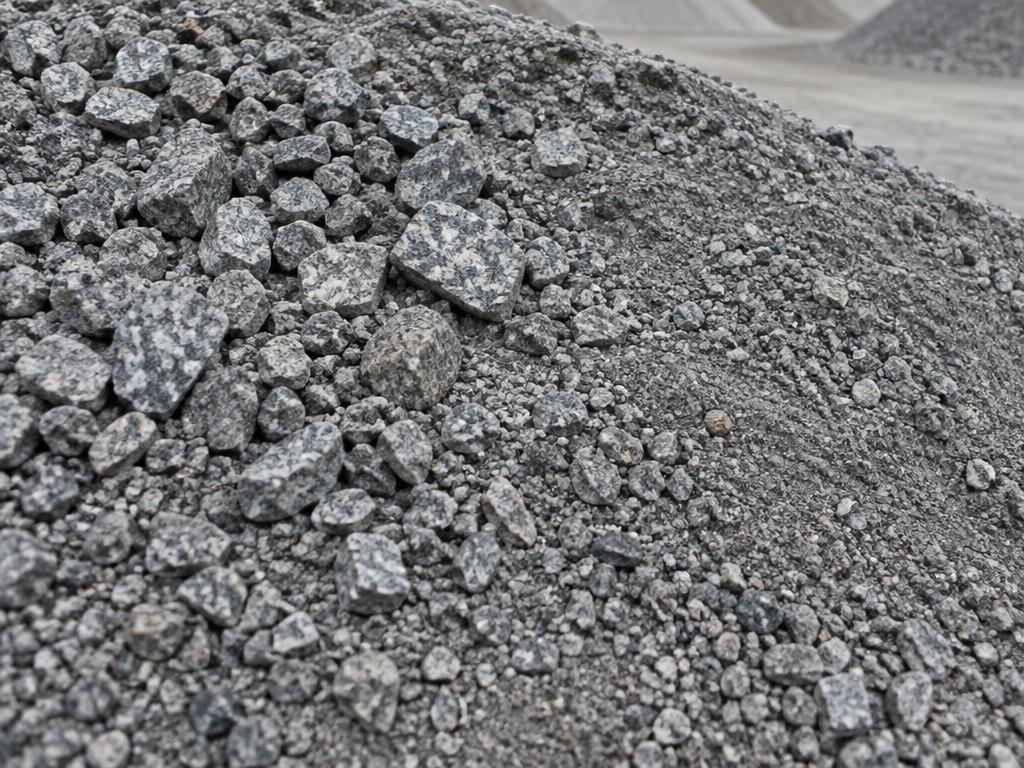 Dense-graded granite road base blended with angular stone and compactable fines